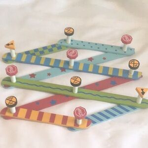 Red and Blue Accordion-Style Wooden Peg Rack used great condition